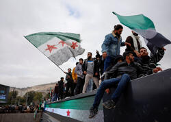 Əsədin devrilməsinin ildönümündə izdiham - Ölən və yaralananlar var - FOTO