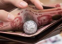 Çinlilər niyə pul kisələrində alüminium folyo daşıyır?