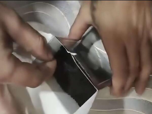 “Beta” çay paketindən yad cisim çıxdı - <span class="color_red">VİDEO</span>