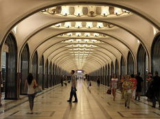 People wait for the train in Mayakovskaya metro station in Moscow
