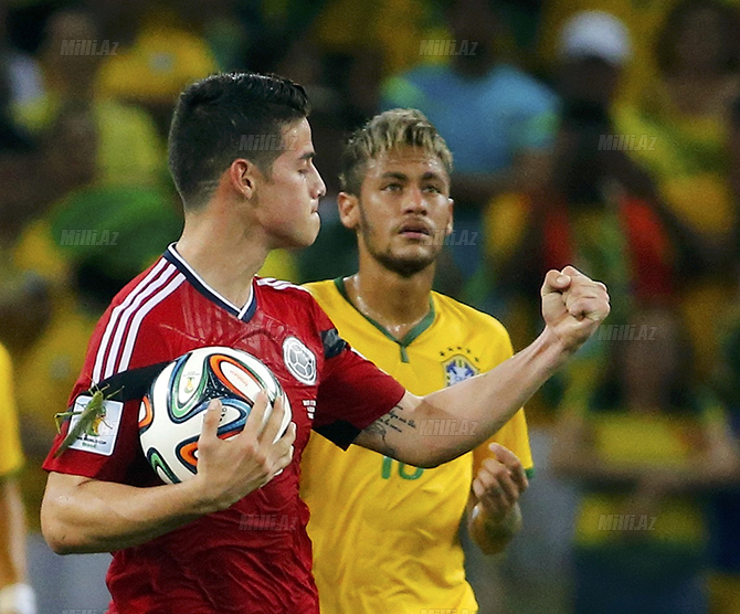 Colombia's Rodriguez celebrates after scoring a penalty against Brazil during their 2014 World Cup quarter-finals at the Castela