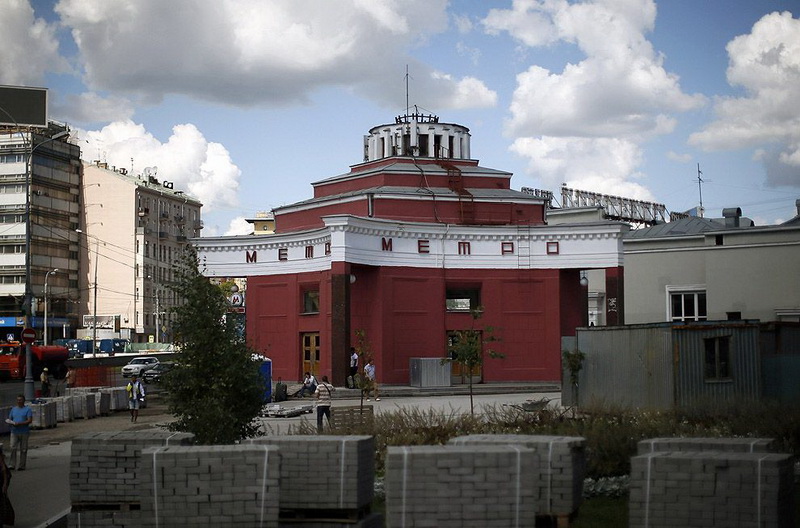 People walk near the entrance to Arbatskaya metro station in Moscow
