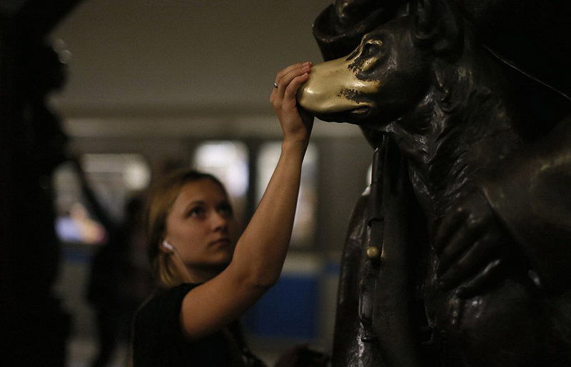 Woman touches nose of the 